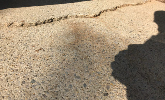 Cracks in concrete driveway of Durham NC home before concrete lifting solution